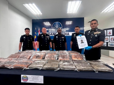 iskandar-puteri-police-chief:-johor-cops-nab-man-carrying-63.5kg-of-ganja 